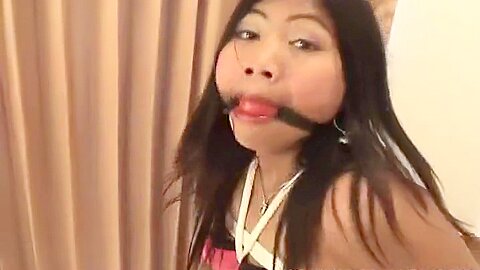 Asian Babe Tied To A Chair