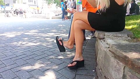 Dangling Black Sandals On Sunny Street