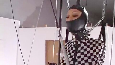 Jewell On The Gordian Treadmill :: Chained Woman in Checkered Suit on Treadmill