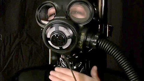 Breath Control And Latex :: Leather Dominatrix Bound With Gas Mask And Syringe